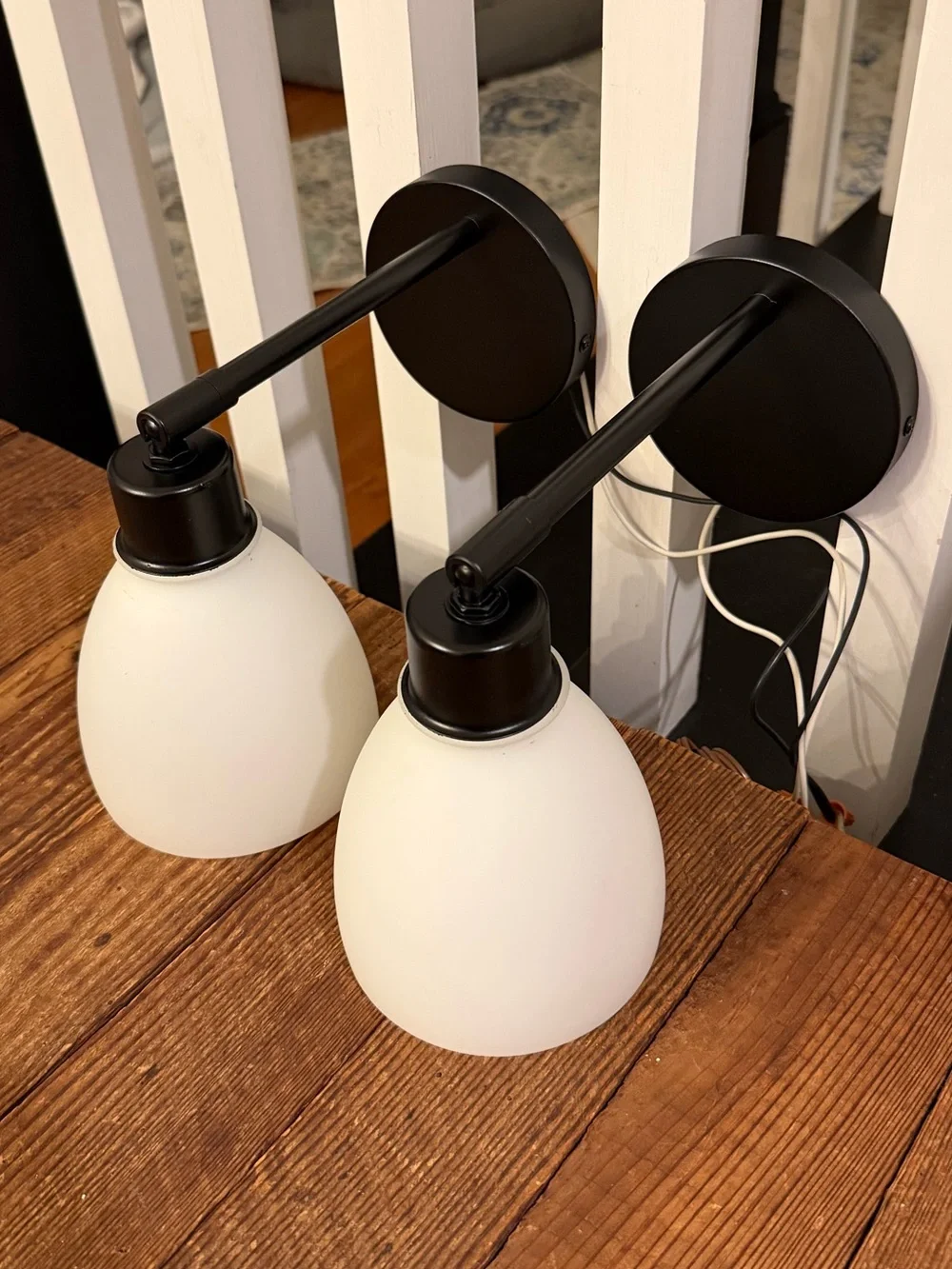 Pair of adjustable swivel/pivot black wall-mount lamps with frost white glass